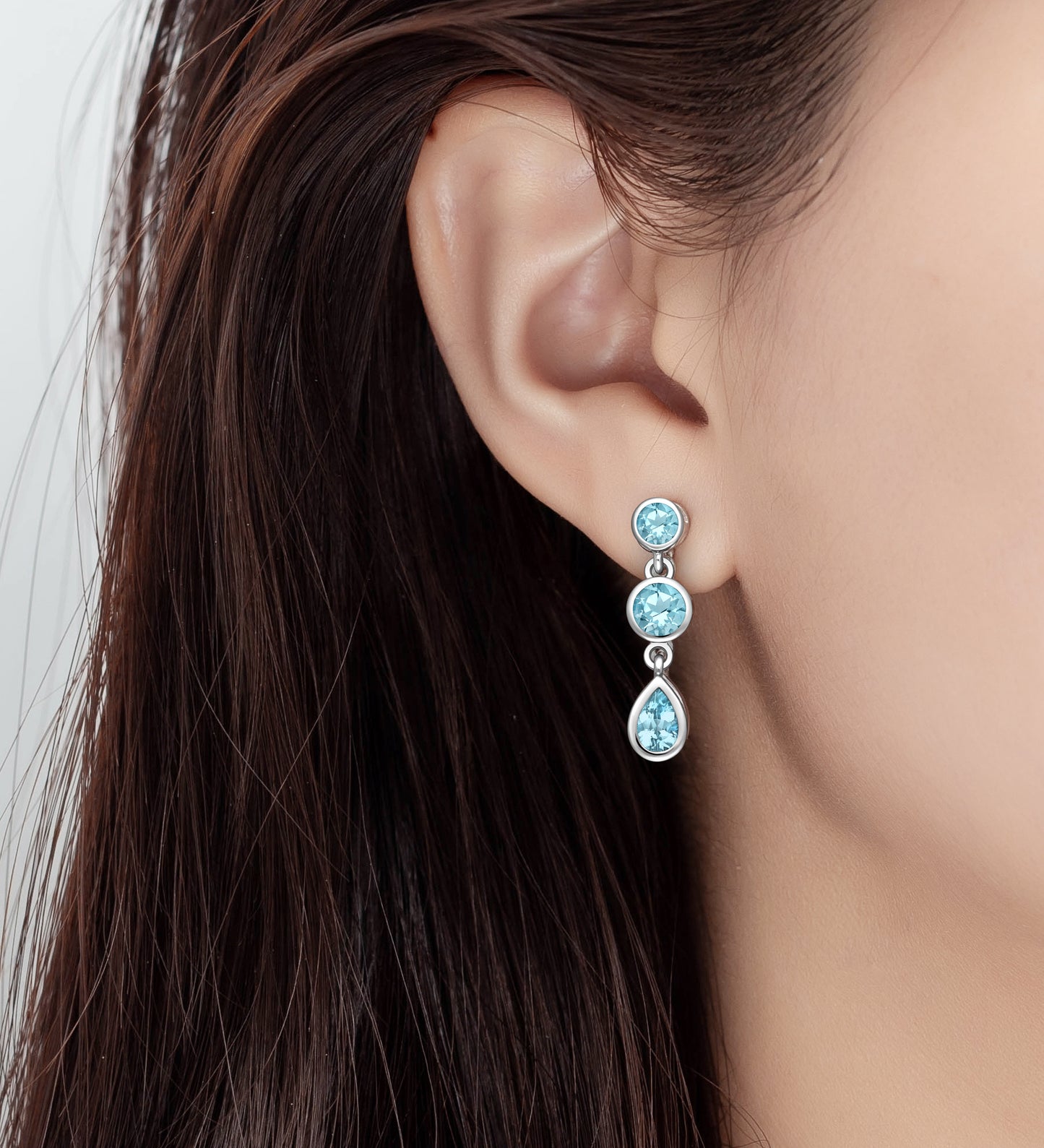 Sterling Silver Push Back Earrings decorated with Sky Blue Topaz