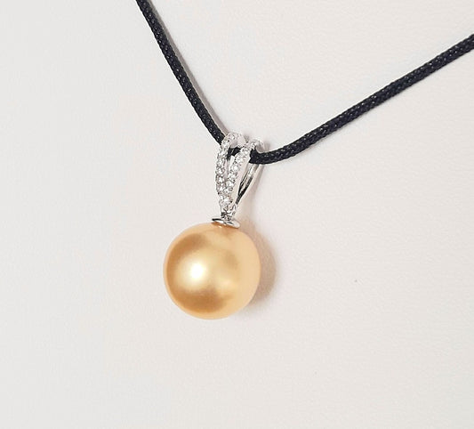 Golden South Sea Pearl set in a Sterling Silver Pendant decorated with Cubic Zirconia